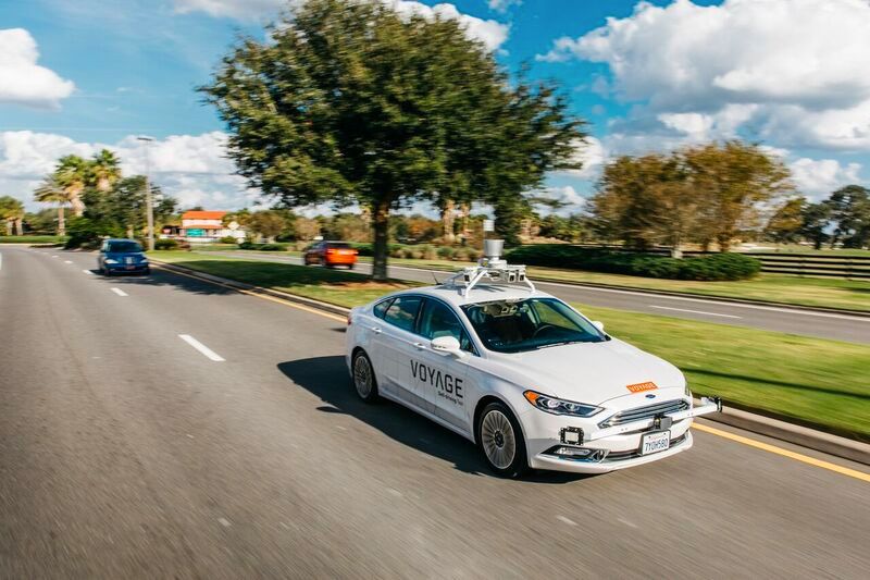 Figure 1. A Voyage self-driving taxi on the road at The Villages community in Florida.