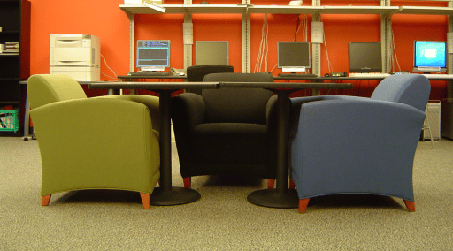 Three armchairs around a table