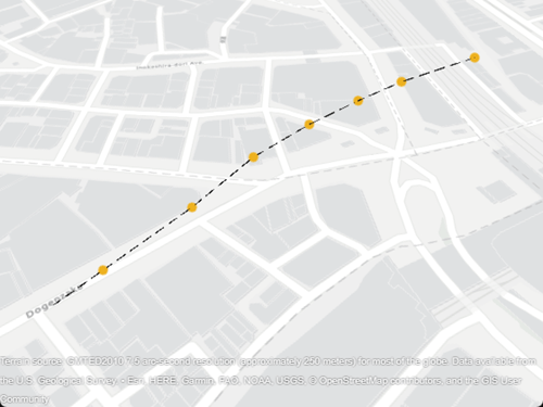 A black, dashed line with yellow circle markers displayed over a road map